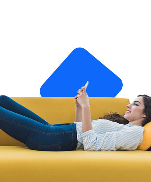 Girl lying on the couch with her smartphone