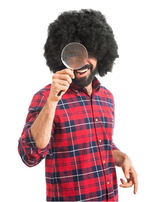 Man looking through a magnifying glass