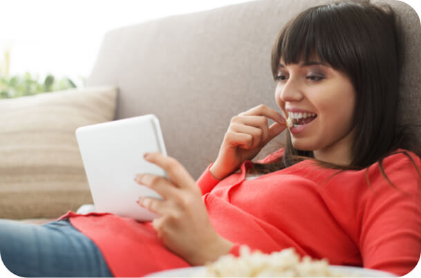 A woman deciding between diffrent brand products