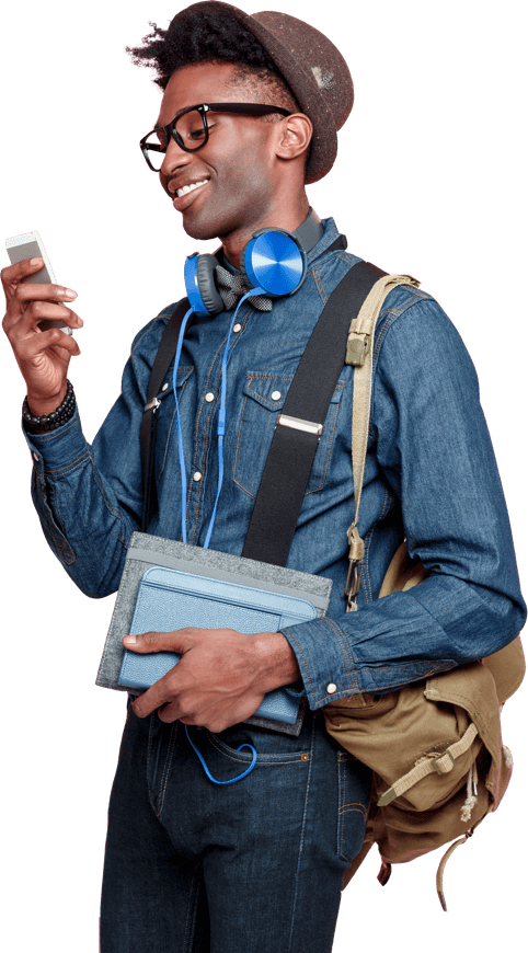 Hip guy with cool gadgets looking at his smartphone